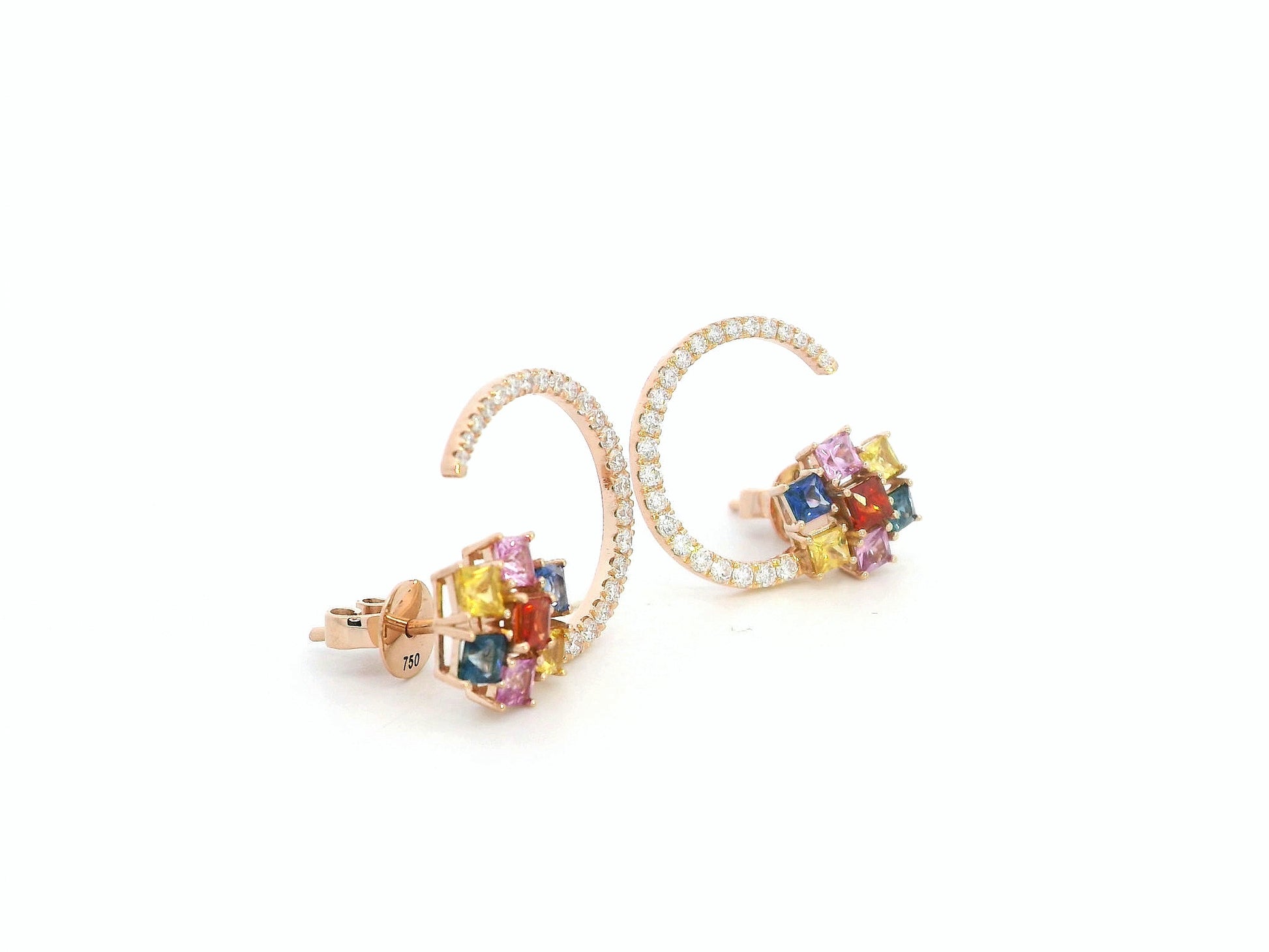 Colorful gemstone earrings on a white background