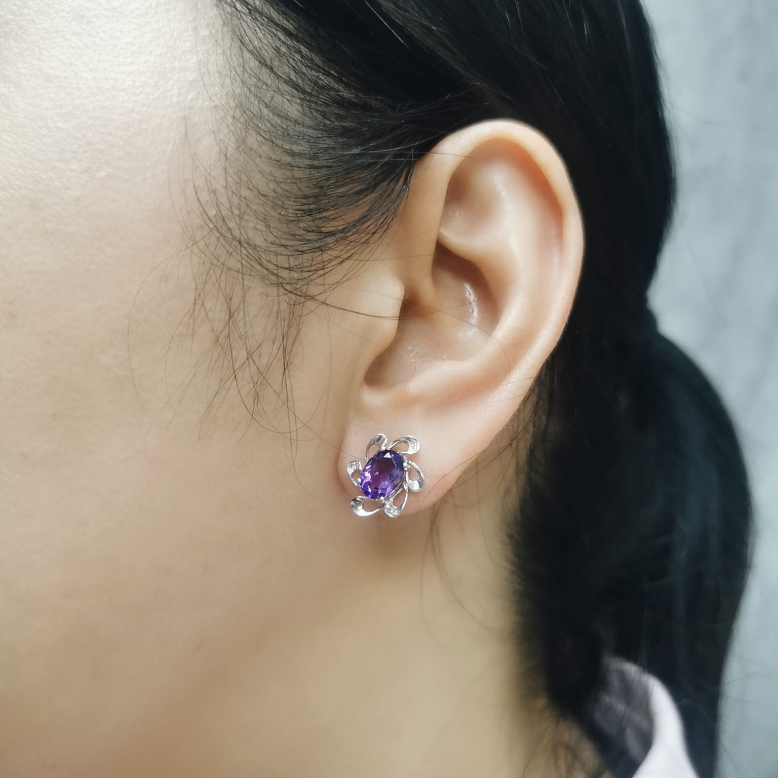 18K white gold amethyst stud earrings with oval purple gemstones and diamond halo in floral setting, elegant fine jewelry