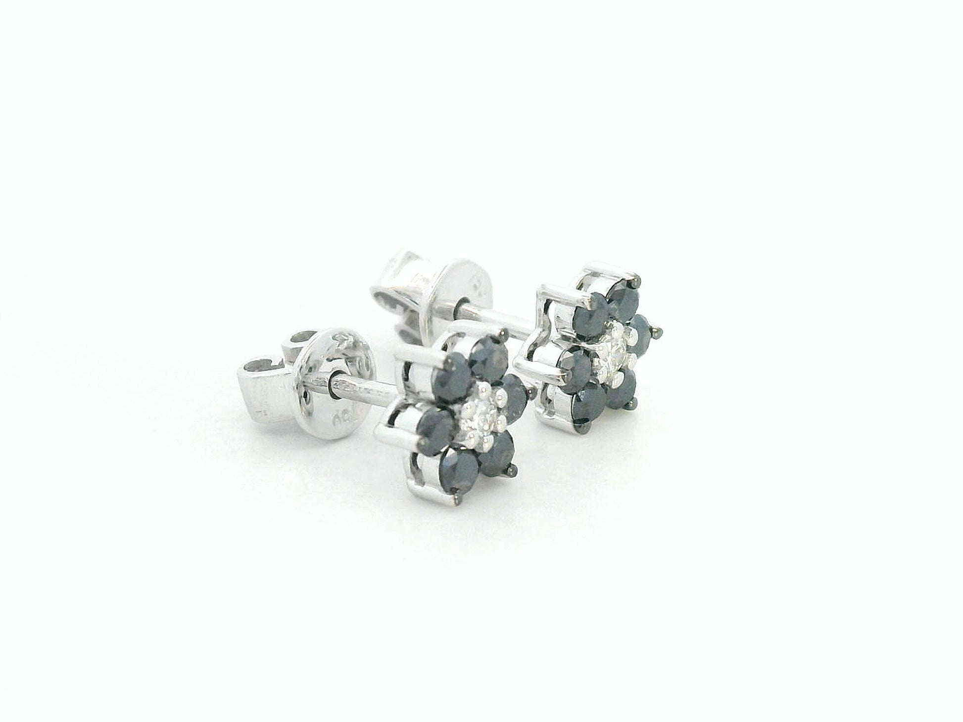Bold black and white diamond earrings in a floral design