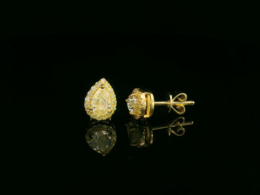 Pear-shaped fancy yellow diamond halo earrings in yellow gold setting
