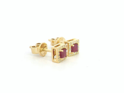 Ruby center with diamond halo detail, fine craftsmanship in 18K gold