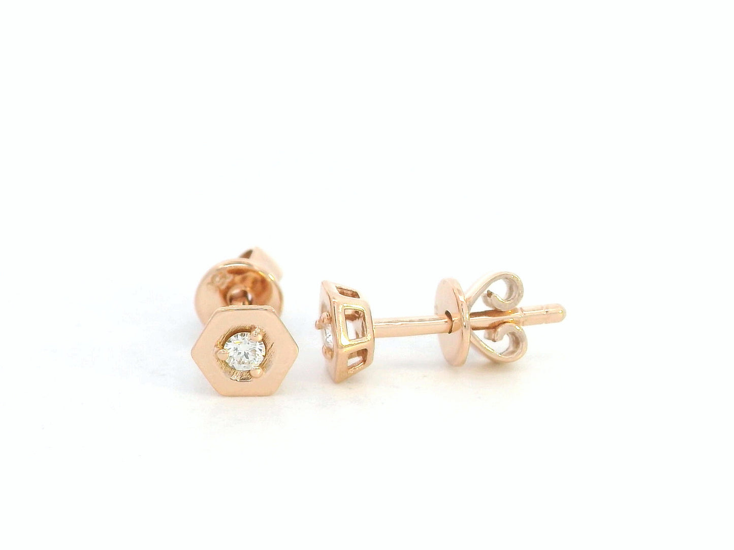 Side profile of 18k rose gold hexagon stud earrings showing push back closure