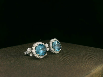 18k white gold London Blue Topaz and diamond halo earrings