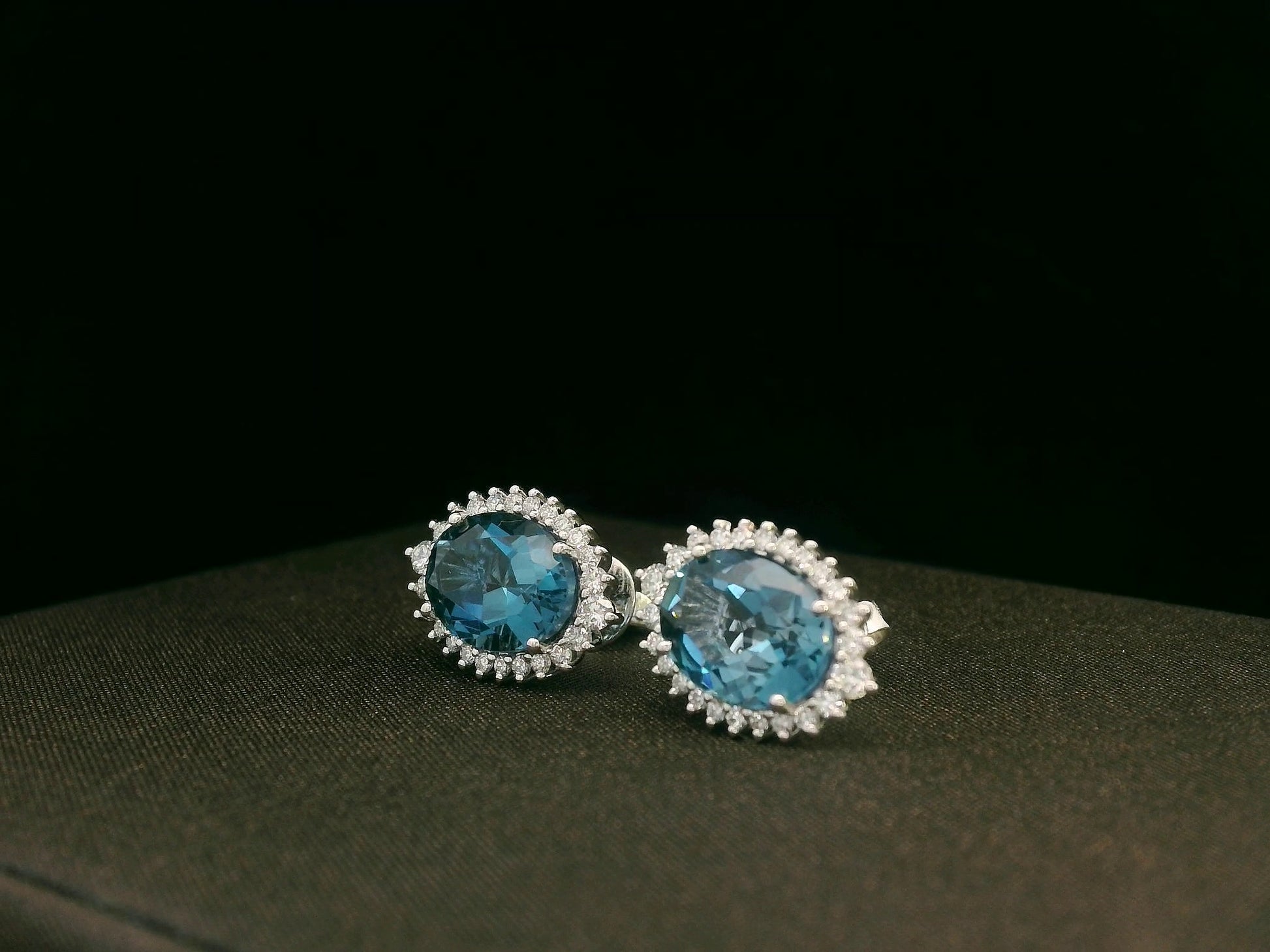 18k white gold London Blue Topaz and diamond halo earrings