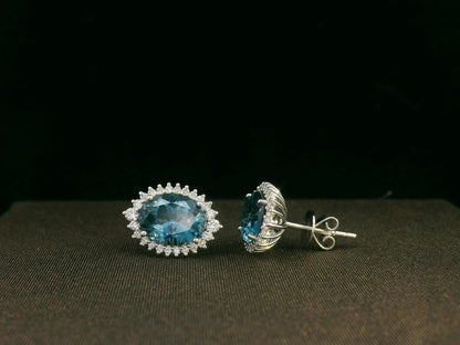 18k white gold London Blue Topaz and diamond halo earrings