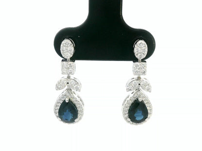 18k white gold dangle earrings with pear-cut blue sapphires totaling 1.85 carat and 0.55 carat diamonds in halo and filigree design