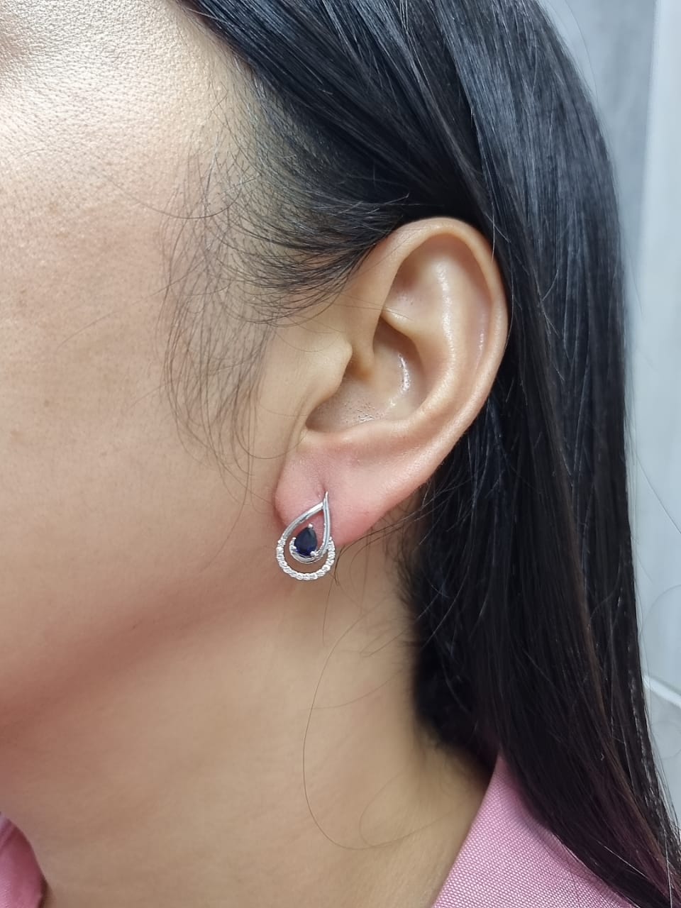 18k white gold teardrop earrings with pear-cut blue sapphires totaling 0.73 carat and 0.15 carat diamonds in partial halo