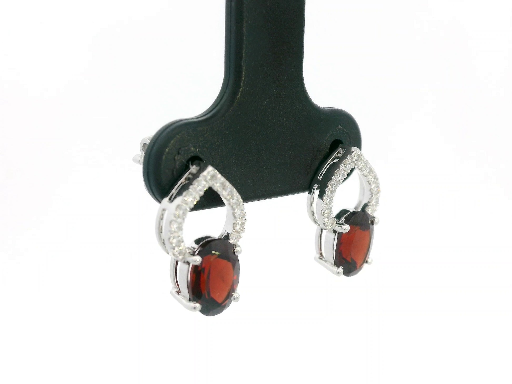 18k white gold stud earrings with oval garnets totaling 1.92 carat and 0.18 carat diamonds in open teardrop design