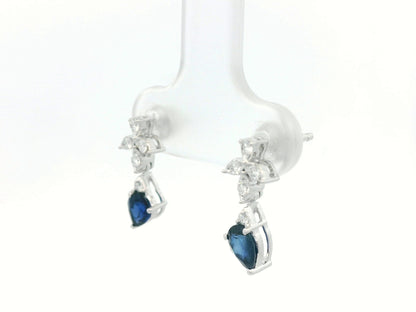 18k white gold floral stud earrings with 0.79 carat pear-cut blue sapphires dangling from 0.16 carat diamond clusters