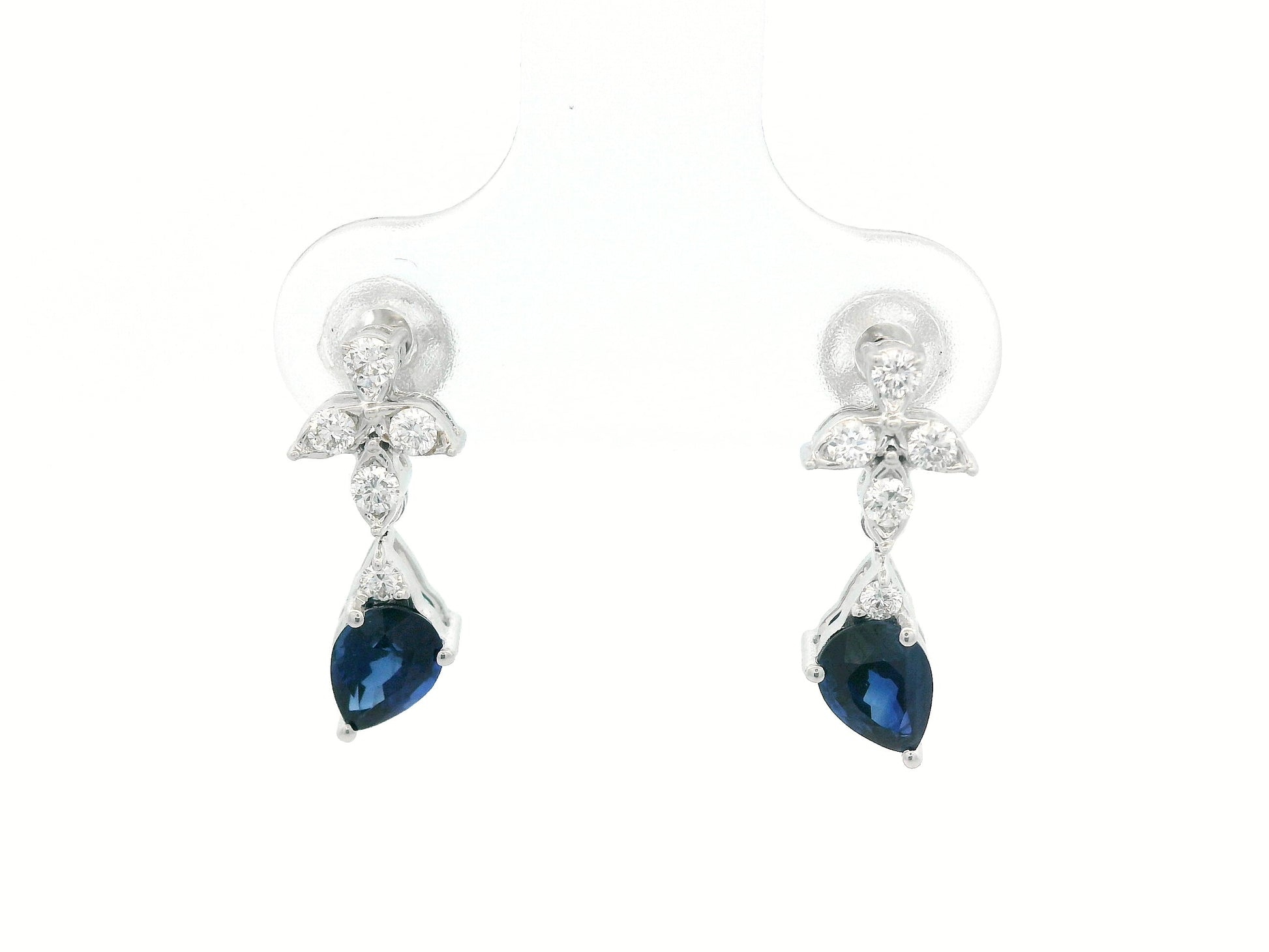 18k white gold floral stud earrings with 0.79 carat pear-cut blue sapphires dangling from 0.16 carat diamond clusters