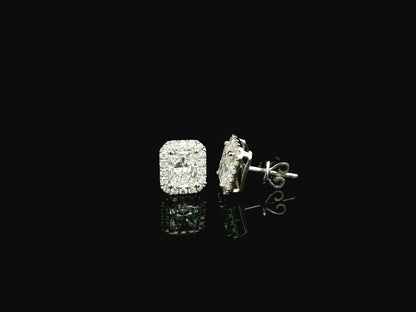 18K white gold diamond halo stud earrings featuring two GIA certified radiant cut diamonds totaling 1.40 carats surrounded by 0.27 carat natural diamond halos.
