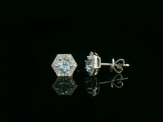 Front view of 18k gold stud earrings with round aquamarines and diamond halo