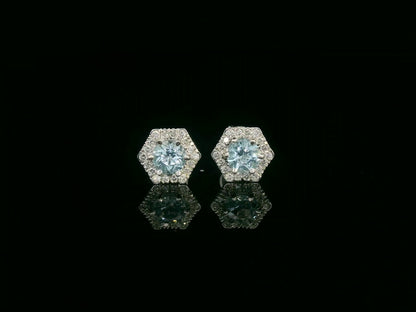 Front view of 18k gold stud earrings with round aquamarines and diamond halo