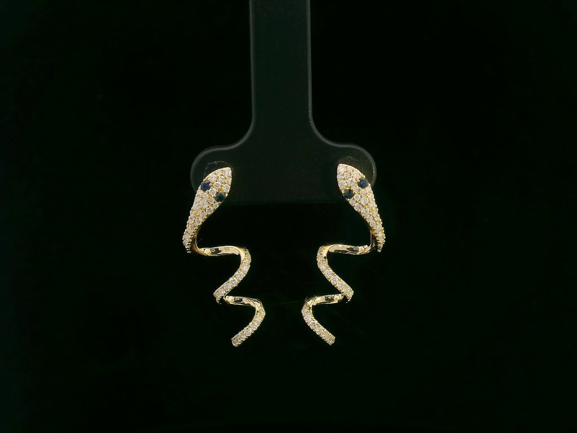 18K yellow gold diamond snake drop earrings with blue sapphire eyes, 0.43 carat diamonds by Emirates Diamonds
