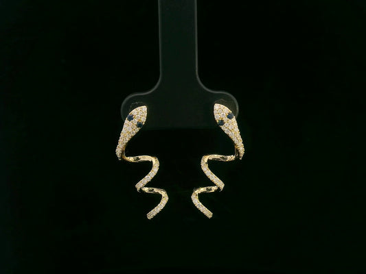 18K yellow gold diamond snake drop earrings with blue sapphire eyes, 0.43 carat diamonds by Emirates Diamonds
