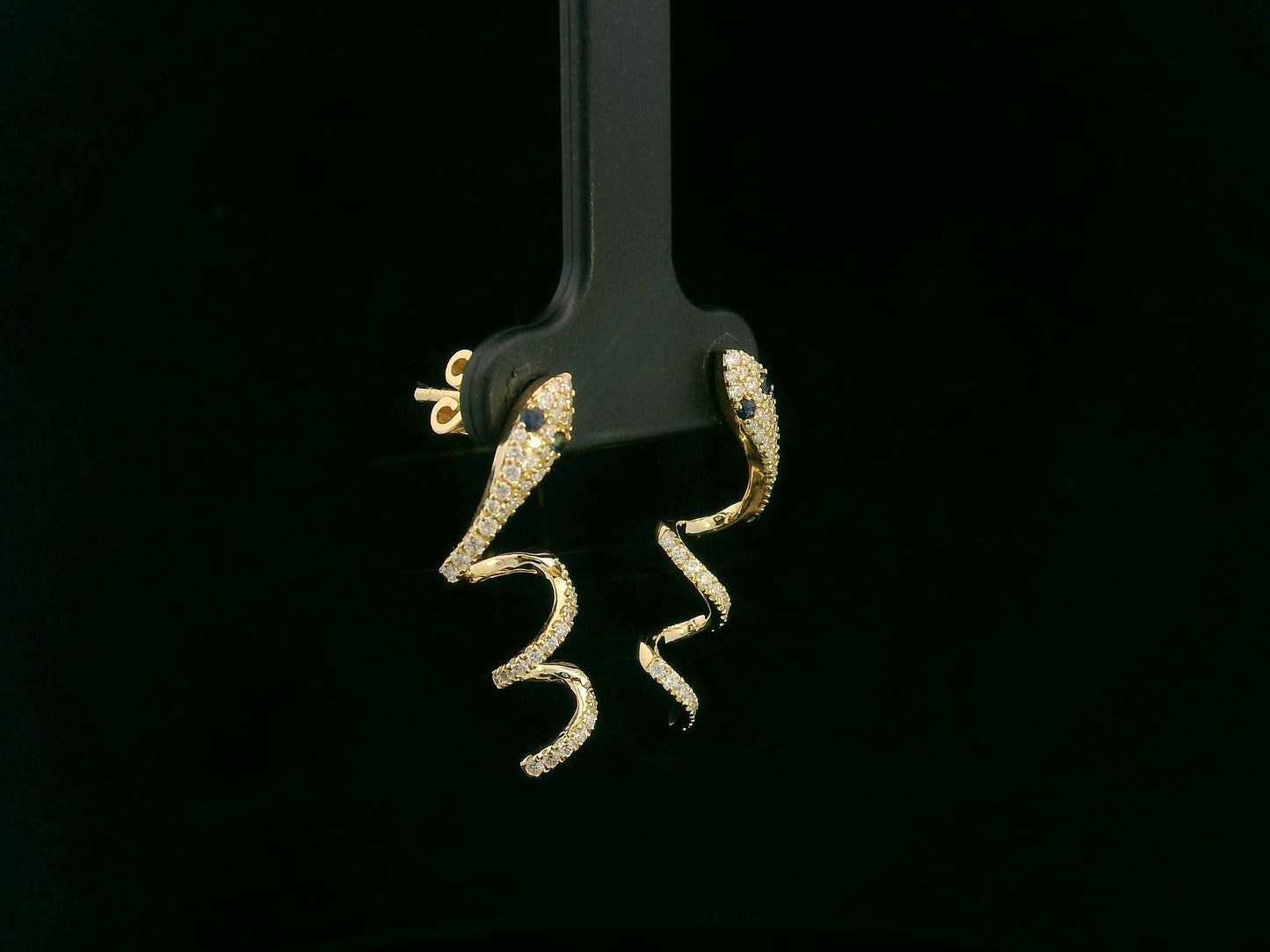 18K yellow gold diamond snake drop earrings with blue sapphire eyes, 0.43 carat diamonds by Emirates Diamonds