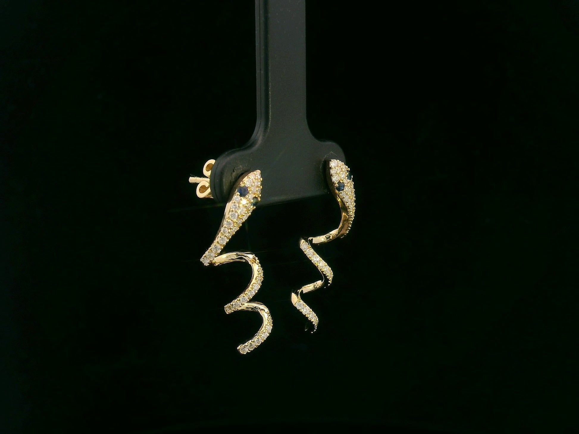 18K yellow gold diamond snake drop earrings with blue sapphire eyes, 0.43 carat diamonds by Emirates Diamonds