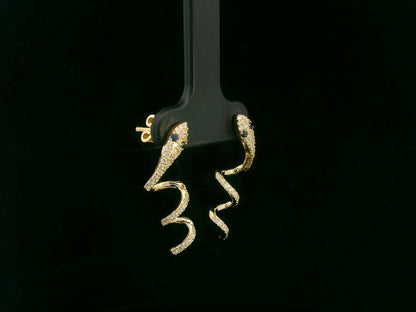 18K yellow gold diamond snake drop earrings with blue sapphire eyes, 0.43 carat diamonds by Emirates Diamonds