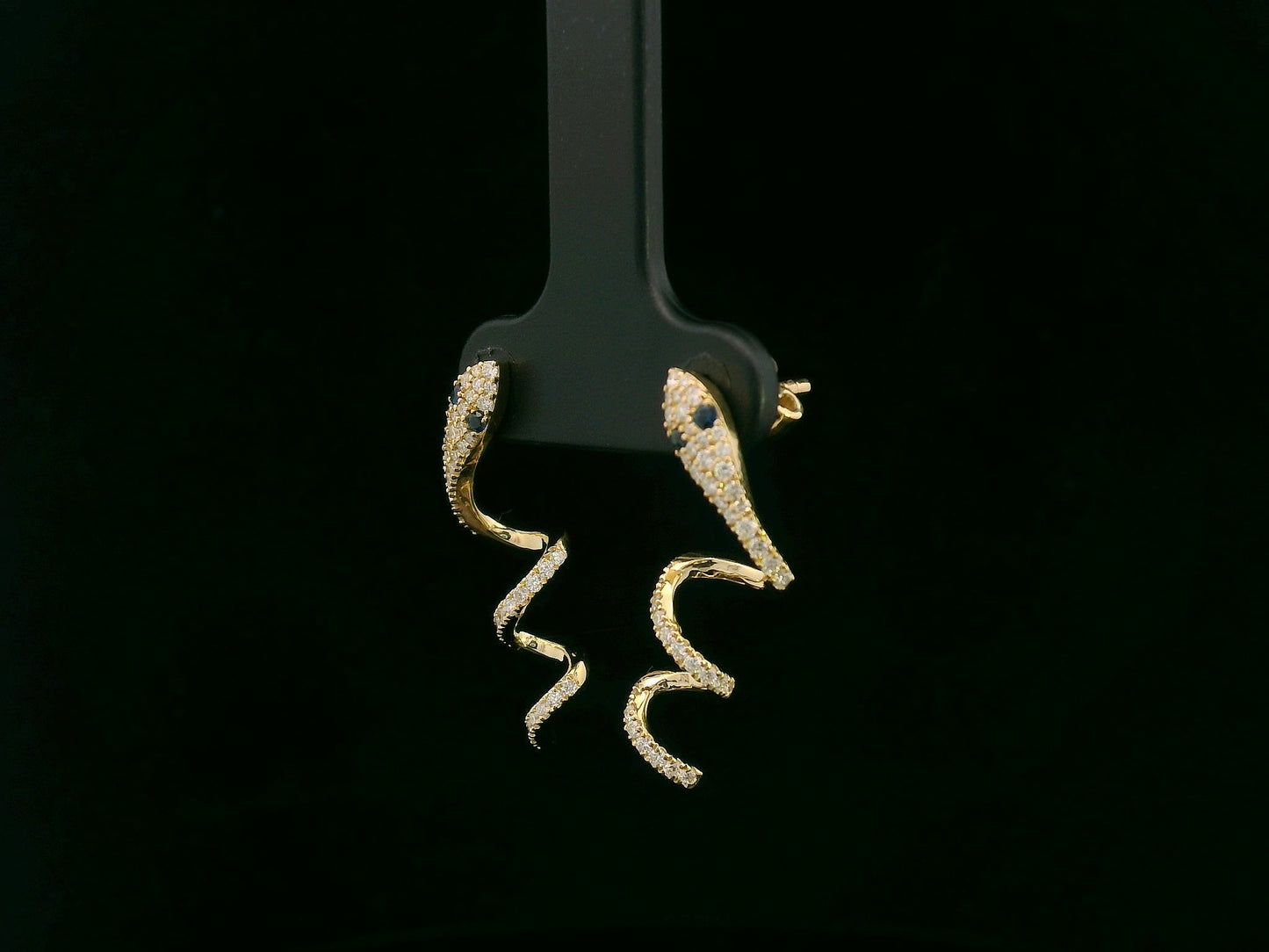 18K yellow gold diamond snake drop earrings with blue sapphire eyes, 0.43 carat diamonds by Emirates Diamonds