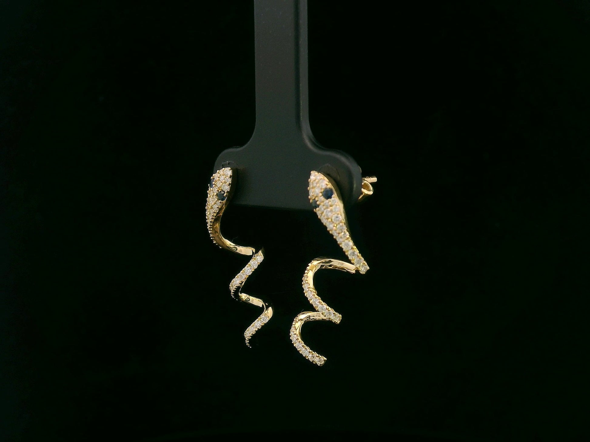 18K yellow gold diamond snake drop earrings with blue sapphire eyes, 0.43 carat diamonds by Emirates Diamonds