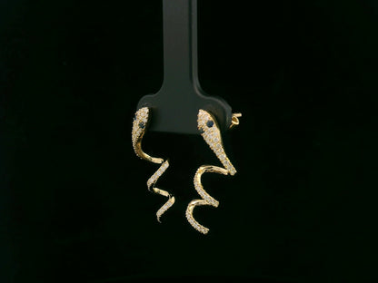 18K yellow gold diamond snake drop earrings with blue sapphire eyes, 0.43 carat diamonds by Emirates Diamonds