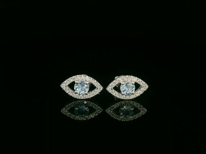 18K white gold evil-eye stud earrings with 0.40ct aquamarine center and 0.23ct pavé diamond halo