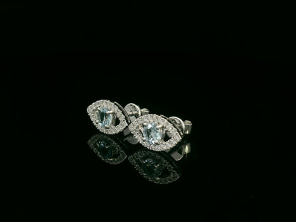 18K white gold evil-eye stud earrings with 0.40ct aquamarine center and 0.23ct pavé diamond halo