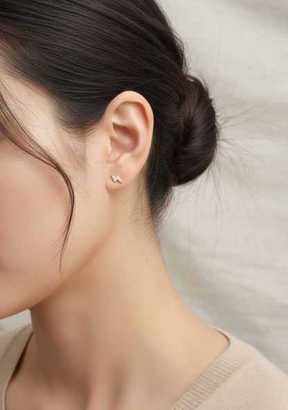 18K white gold geometric lightning bolt pavé diamond stud earrings – minimalist modern earrings by Emirates Diamonds.