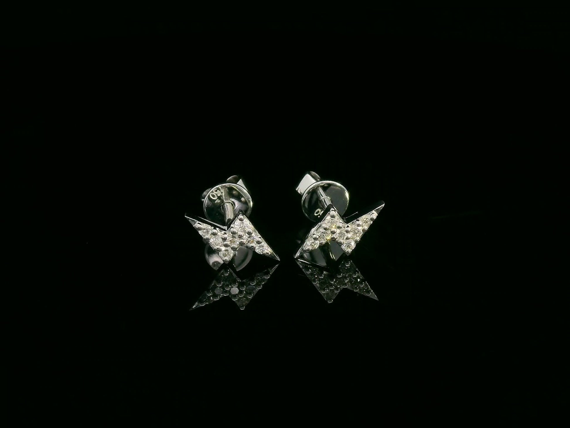 18K white gold geometric lightning bolt pavé diamond stud earrings – minimalist modern earrings by Emirates Diamonds.