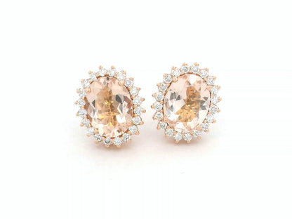 18K rose gold morganite and diamond halo stud earrings – oval morganite studs with pavé diamond halo by Emirates Diamonds.