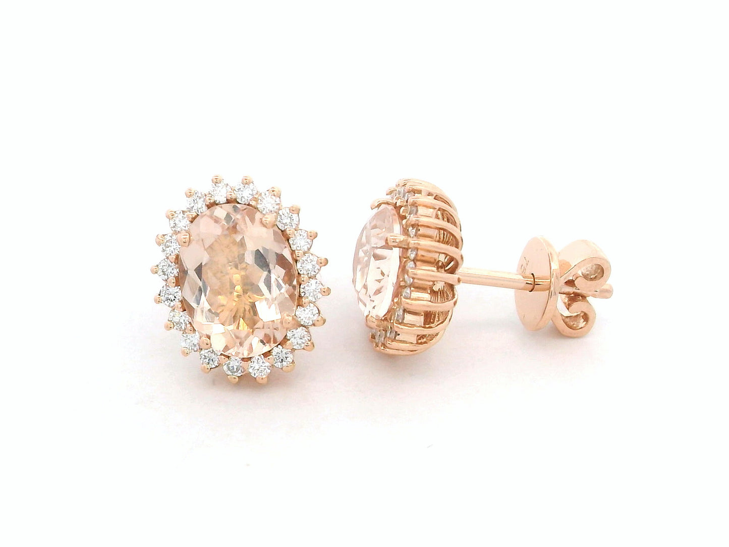 18K rose gold morganite and diamond halo stud earrings – oval morganite studs with pavé diamond halo by Emirates Diamonds.