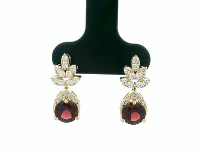 18K yellow gold leaf earrings with a toatl of 1.93ct round cut  garnets and 0.41ct pavé diamonds