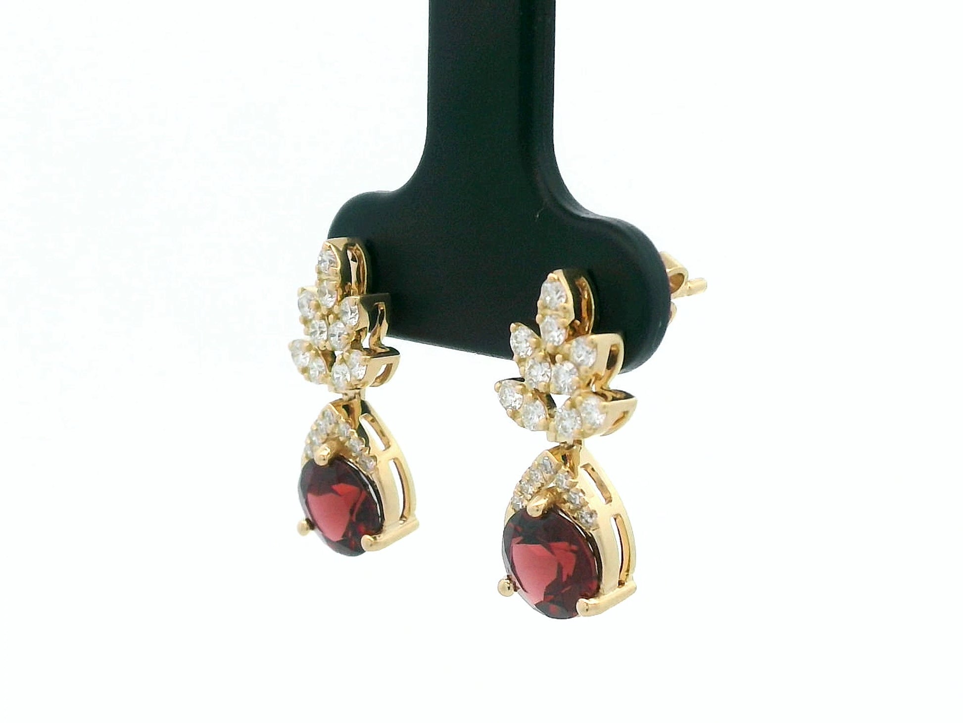18K yellow gold leaf earrings with a toatl of 1.93ct round cut  garnets and 0.41ct pavé diamonds