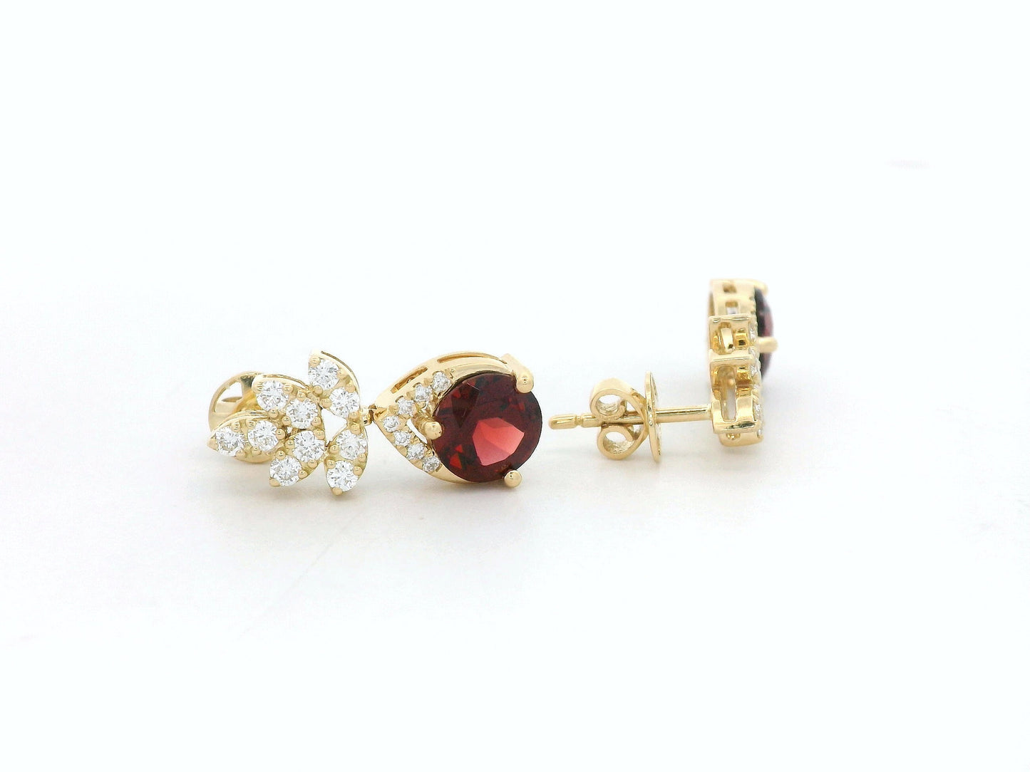 18K yellow gold leaf earrings with a toatl of 1.93ct round cut  garnets and 0.41ct pavé diamonds