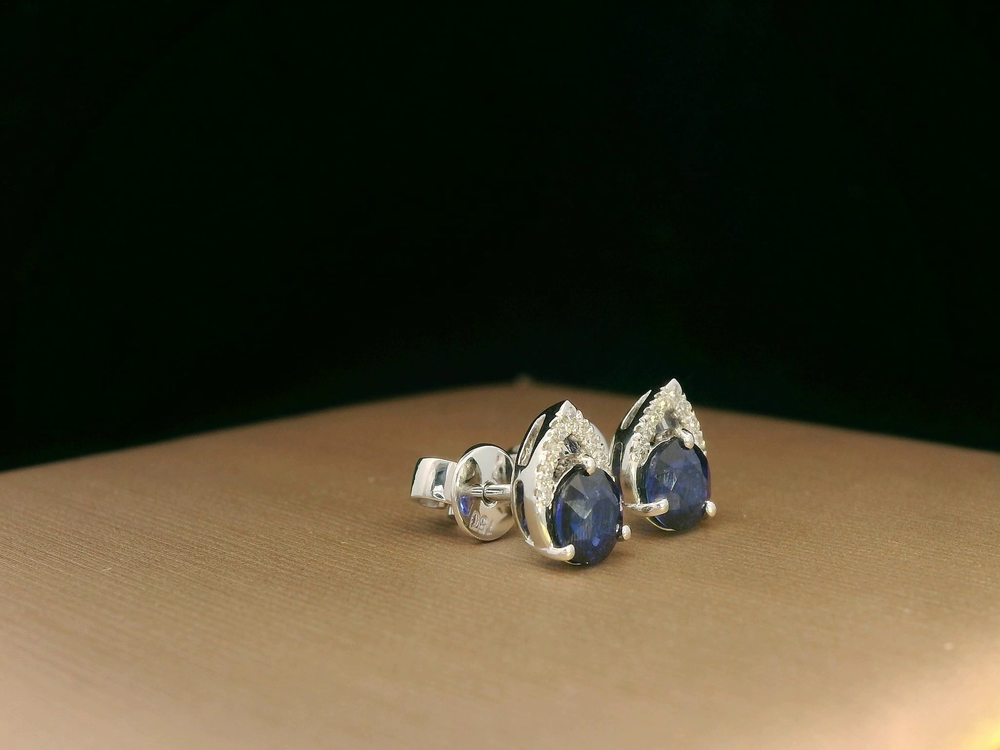 18K white gold teardrop halo stud earrings with round blue sapphires and diamonds