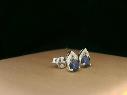 18K white gold teardrop halo stud earrings with round blue sapphires and diamonds