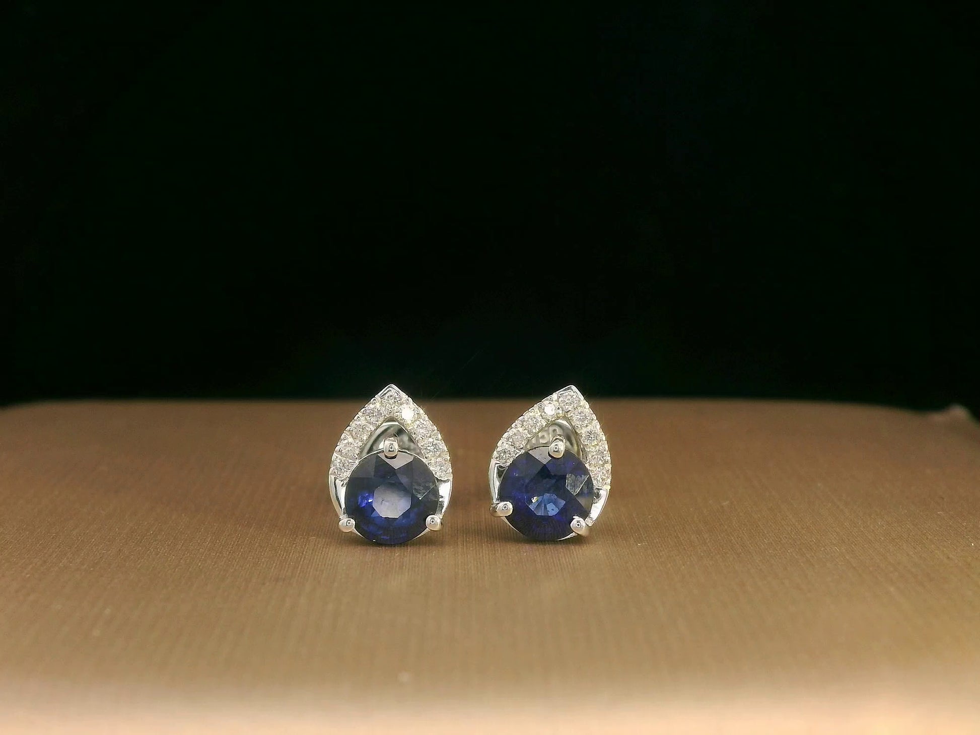 18K white gold teardrop halo stud earrings with round blue sapphires and diamonds
