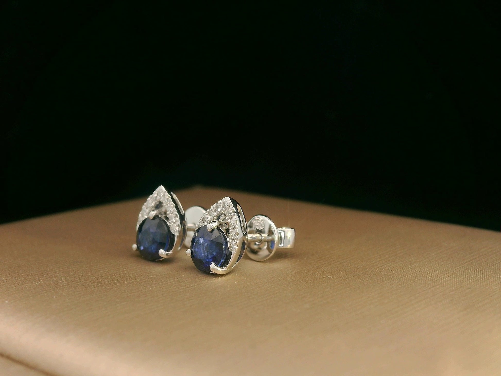 18K white gold teardrop halo stud earrings with round blue sapphires and diamonds