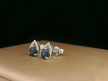 18K white gold teardrop halo stud earrings with round blue sapphires and diamonds