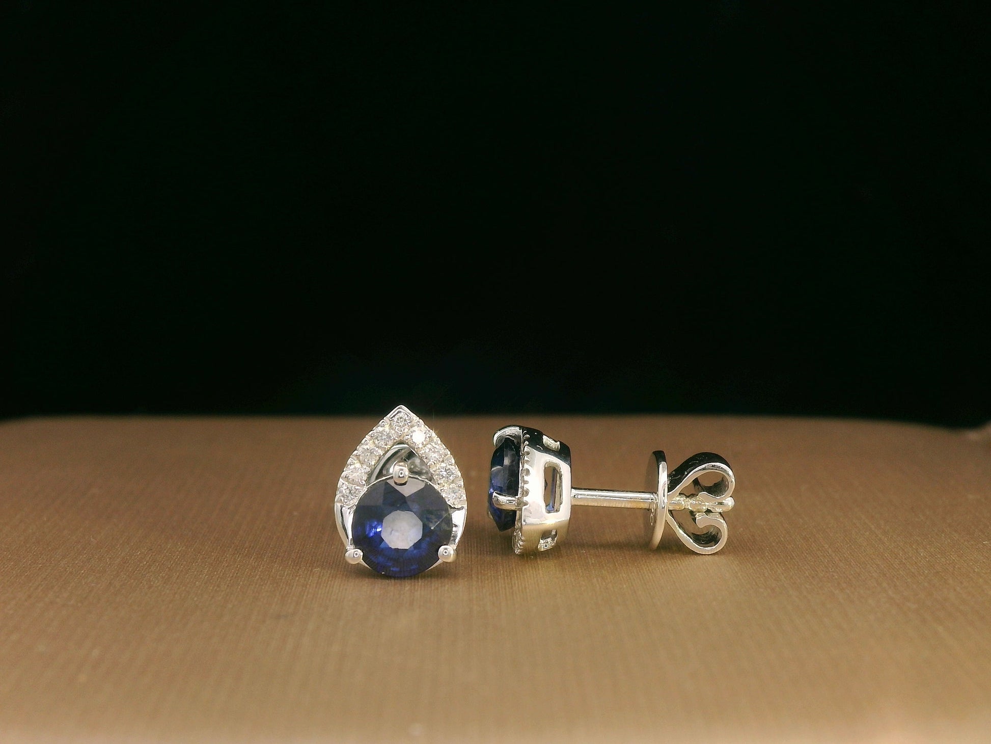 18K white gold teardrop halo stud earrings with round blue sapphires and diamonds