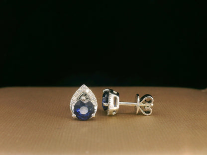 18K white gold teardrop halo stud earrings with round blue sapphires and diamonds