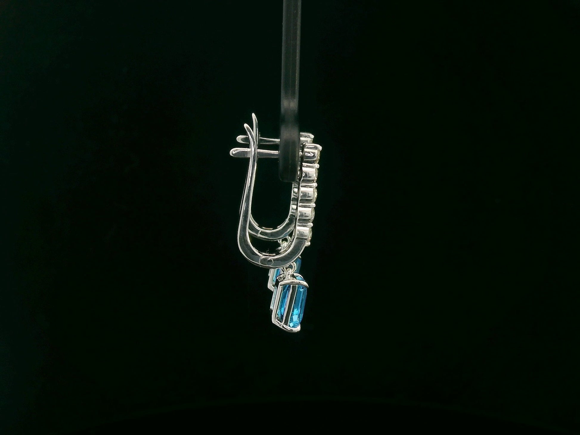 18K white gold dangle earrings with 2.32 ct emerald-cut blue topaz and 0.58 ct round diamonds