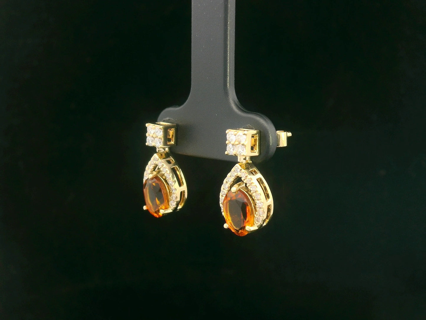 Oval citrine and diamond halo earrings in 18K yellow gold by Emirates Diamonds