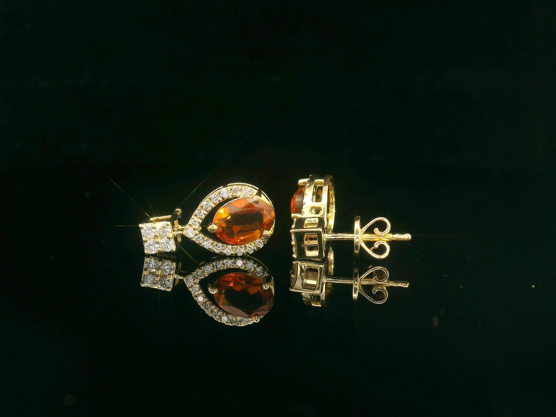 Oval citrine and diamond halo earrings in 18K yellow gold by Emirates Diamonds