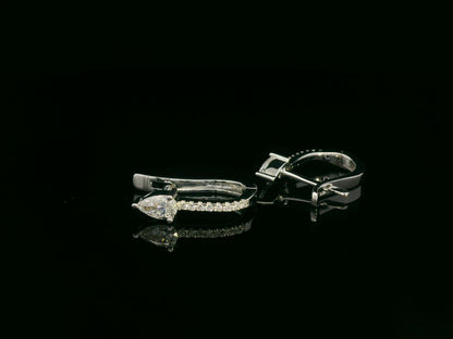 18K white gold hoop earrings with pear-shaped diamonds on top and diamond pavé front by Emirates Diamonds