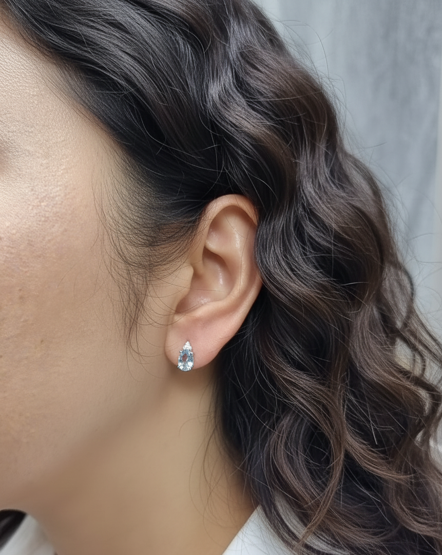 Oval aquamarine and diamond cluster earrings in 18K white gold by Emirates Diamonds