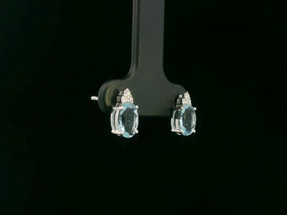 Oval aquamarine and diamond cluster earrings in 18K white gold by Emirates Diamonds