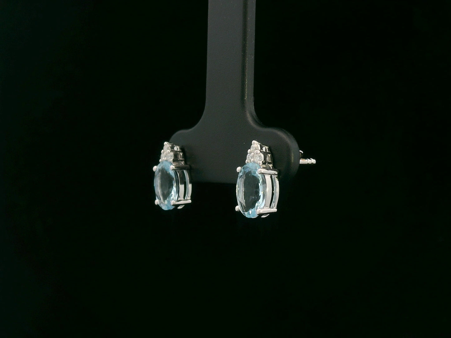 Oval aquamarine and diamond cluster earrings in 18K white gold by Emirates Diamonds