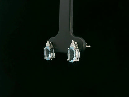 Oval aquamarine and diamond cluster earrings in 18K white gold by Emirates Diamonds