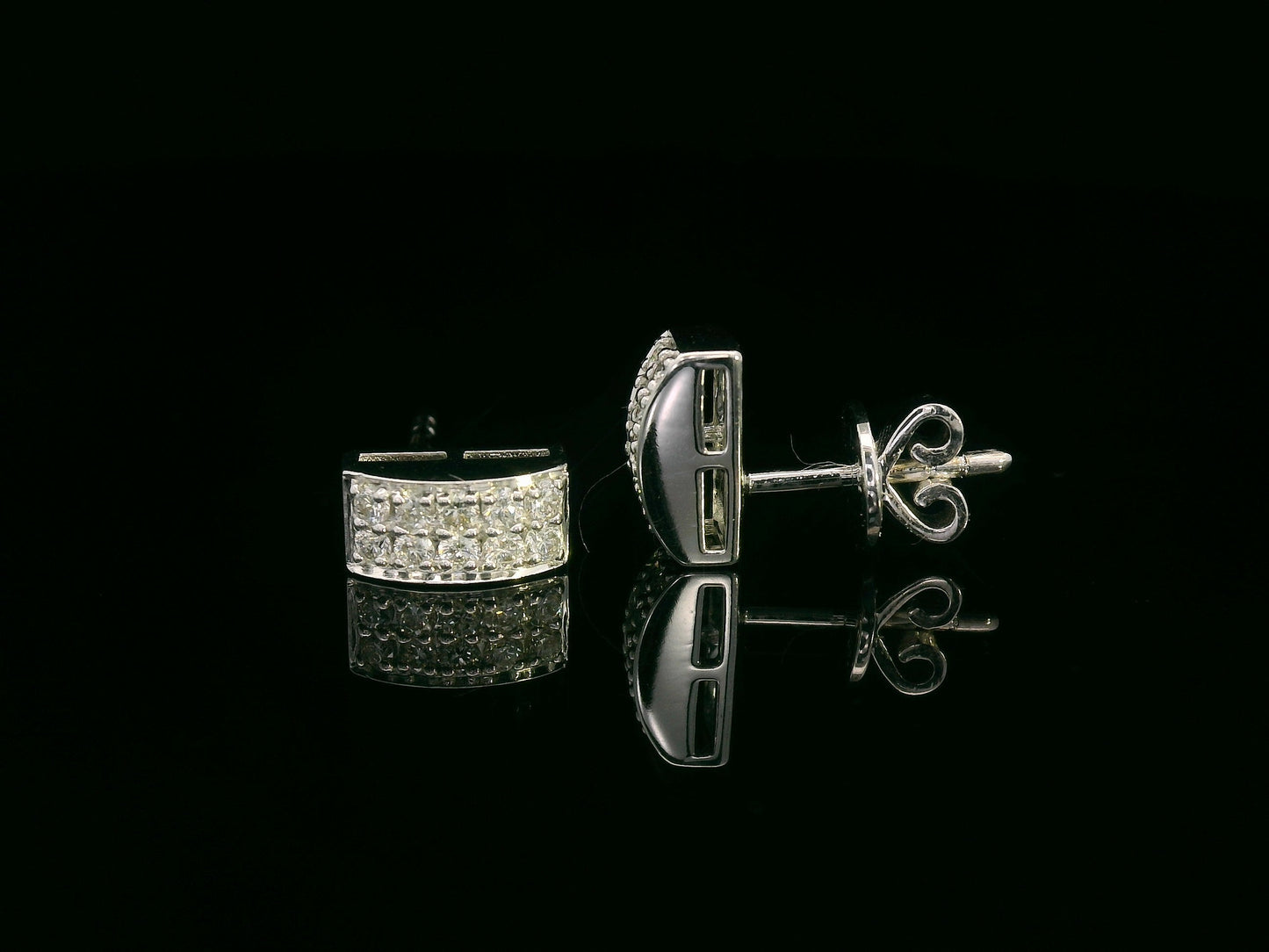 18K white gold pavé diamond bar stud earrings – minimalist curved design with 0.28ct diamonds by Emirates Diamonds.